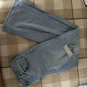 Light wash, super high rise wide-legged ripped jeans